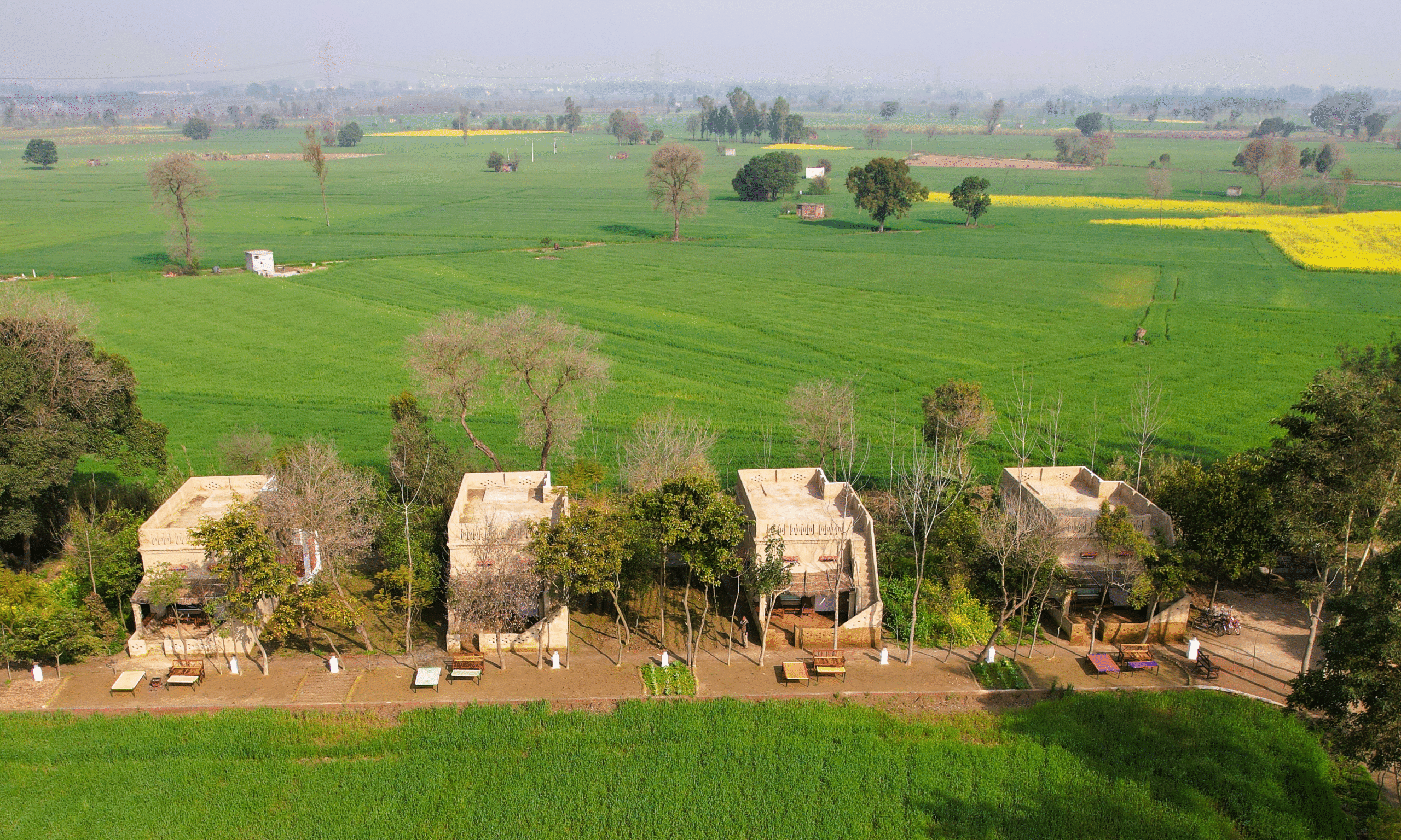 Mud cottage accommodation at a Punjab village farmstay nestled in a serene environment of green farming fields